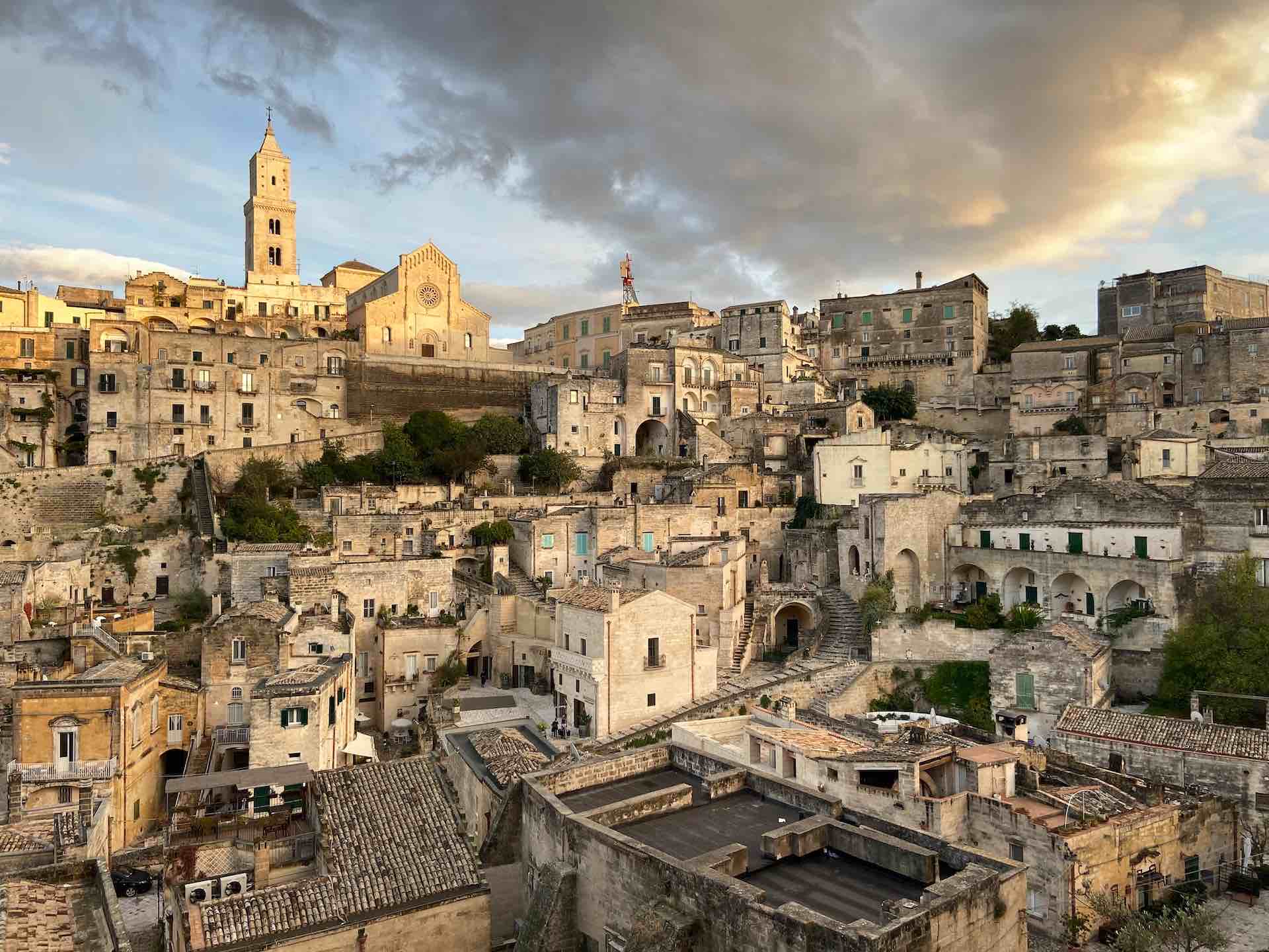 Matera's sand-coloured buildings in the morning sunlight. 
