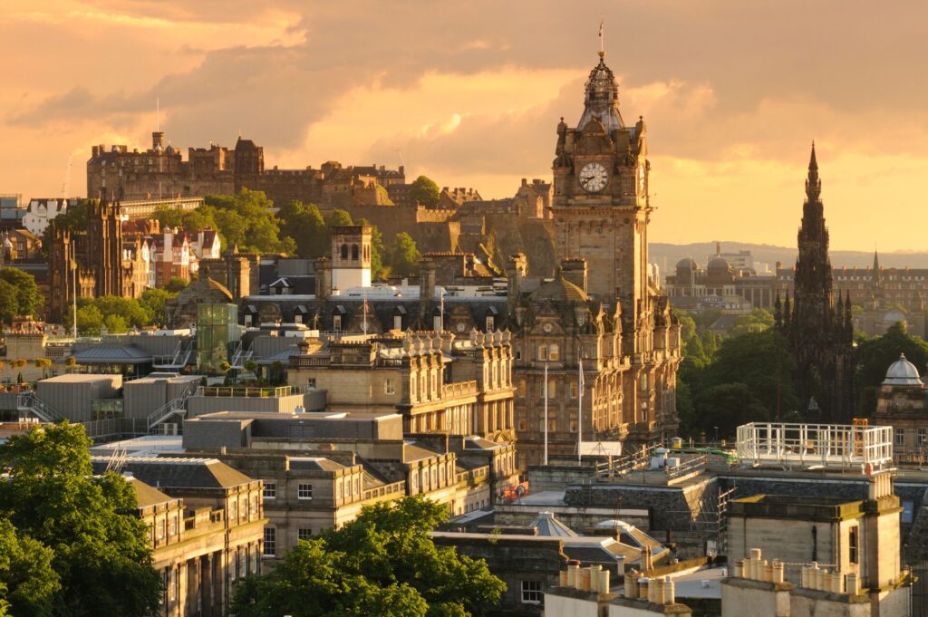 The vibrant city of Edinburgh at sunset, boasting a multitude of exquisite museums and galleries.