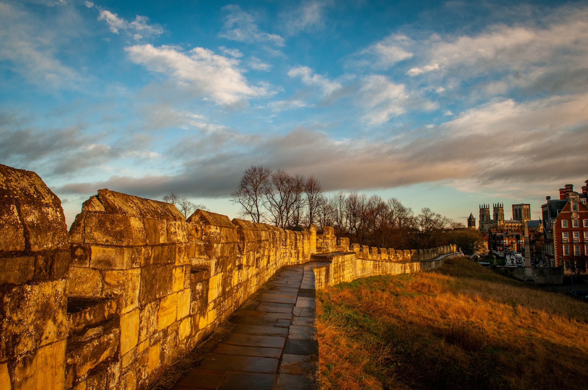 York's Roman walls, photographed at sunset with blue sky behind