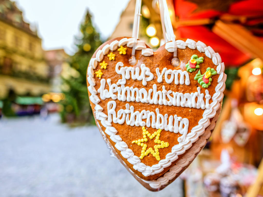     A heart-shaped gingerbread hanging from a Christmas tree in Rothenburg.