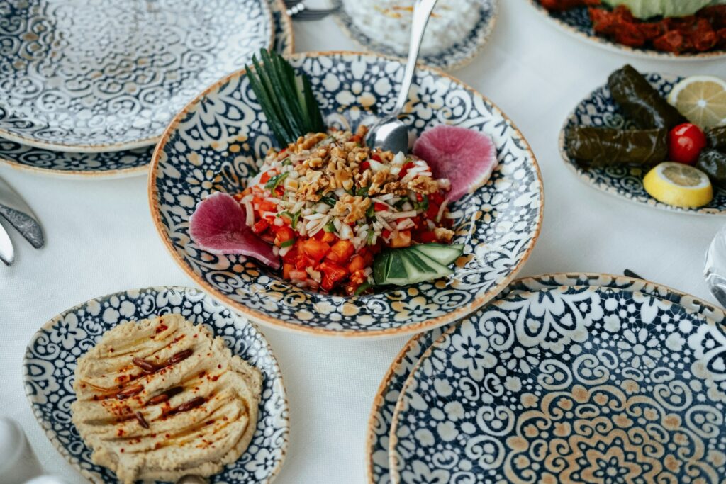 Colourful display of Greek food in patterned bowls