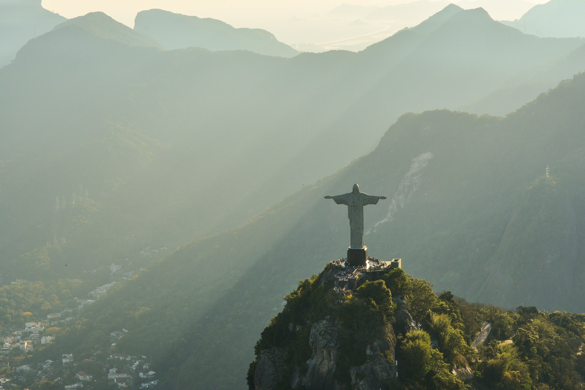 Photo of Christ the Redeemer Statue in Rio de Janiero with mountains in the background