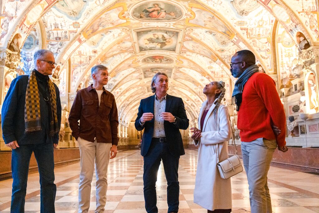 Insight Vacations Travel Director shows guests around inside the Munichh Residenz