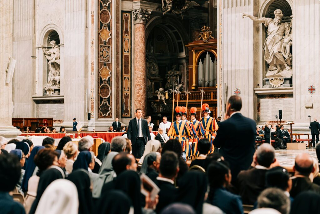 The Swiss Guards inside St Peter's Basilica, among a crowd of worshippers