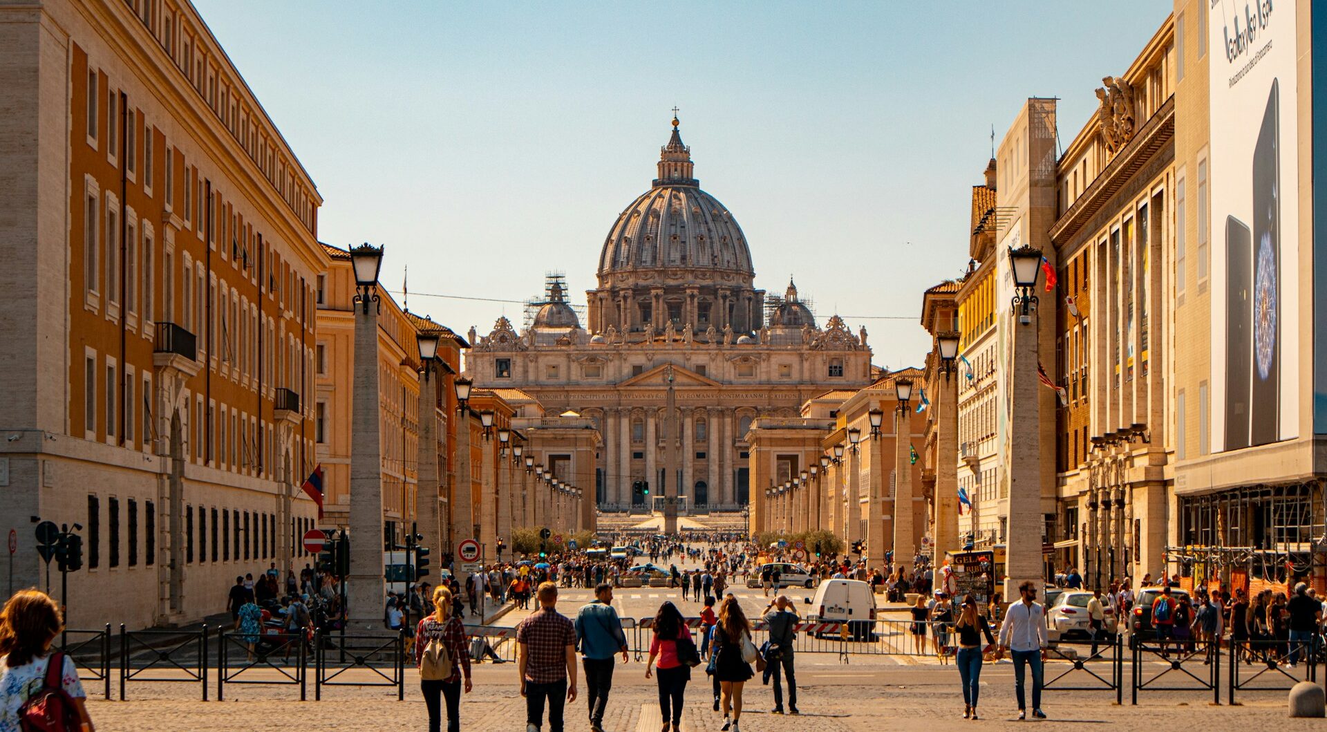 Photo looking down a road towards St Peter's Basilica and the Vatican City in Rome