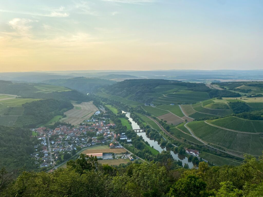 Aerial view of the River Rhine, with green hills and fields either side