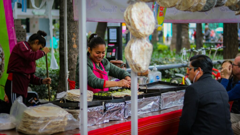 women preparing street food in Mexico