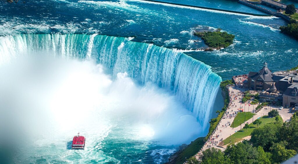 A boat sails on Horseshoe Falls at Niagara Falls, Ontario, Canada 