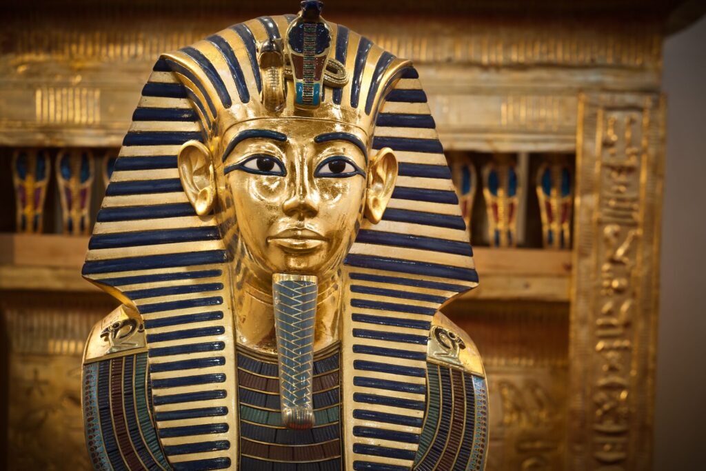 An Egyptian mask of gold and green.