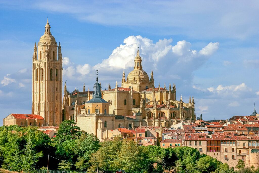 Medieval Segovia Cathedral in Spain, with a bright blue sky